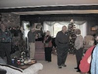 Members exchanging Christmas wishes in the Dalrymple's gorgeous living room.